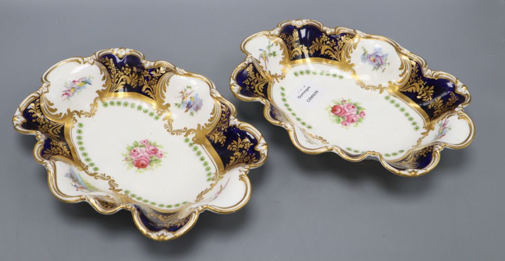 A pair of George Jones for Alfred Pearce Crescent china shaped oval dessert dishes, painted with rose bouquets, width 27cm